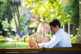 couple in love on a park bench