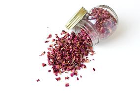 dry rose petals in a glass jar