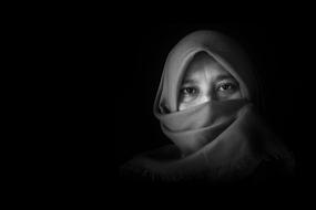 black and white photo of a woman with a closed face