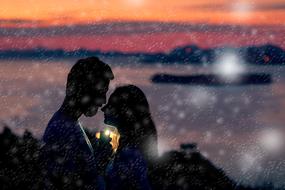 lovers at sunset in blurred background