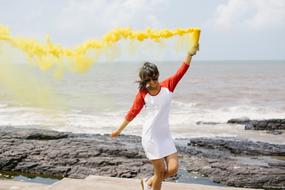 woman Happy with yellow smoke