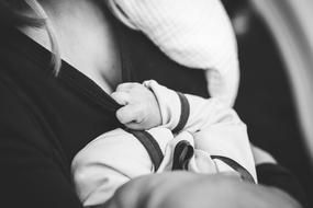 Black and white photo of the mother holding child