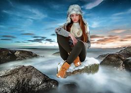 Young Female on snowy stone