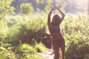 woman at garden at sunlight