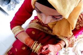 Muslim woman in colorful hijab, and with bracelets