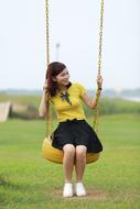 Girl swinging on swing