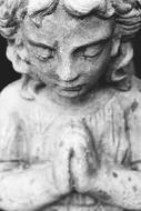 Black and white photo of the praying woman statue