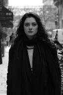 black and white photo of a woman on the street in Paris