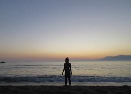 Woman Silhouette on beach in Crete