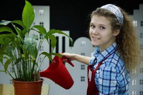 a girl and a flower in a pot