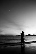 silhouette of a girl on the sea beach Dadaepo