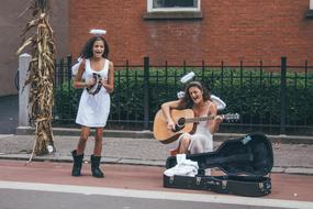 angel costumes artists on street