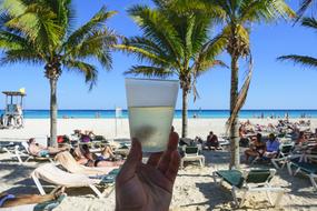 Iced cocktail on the beach in Cancun, Mexico