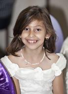 smiling girl in white princess dress
