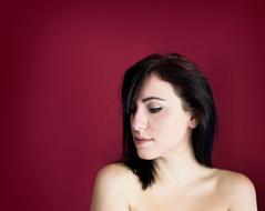 brunette on a burgundy background