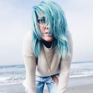 girl with turquoise hair by the sea