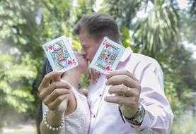 bride and groom with playing cards in their hands