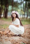 Model Fashion Girl posing in forest