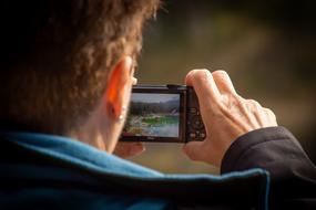 Photographer man with device