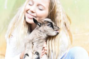 Young Beautiful Woman and goat