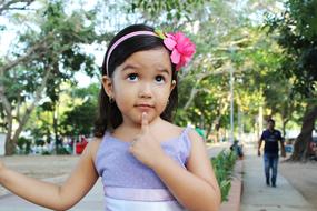 beautiful girl with a pink flower on her head