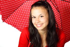 brunette with red polka dot umbrella