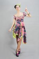 Posing woman in colorful clothing at white background in Indonesia