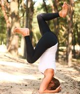 woman practicing yoga outside