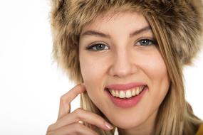 smiling woman in fur hat