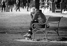 monochrome photo of Individually Person sitting on Bench