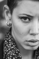 Black and portrait of the woman with make-up and earrings