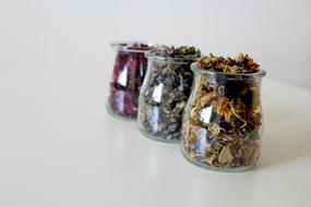 dry flower petals in transparent jars