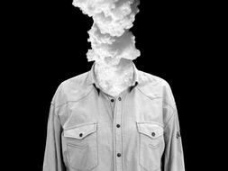 Black and white photo of the smoke, from the shirt, at black background