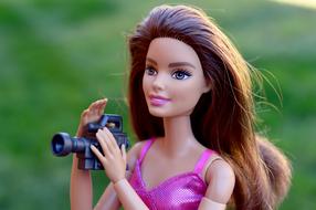 Barbie with video camera, doll close up