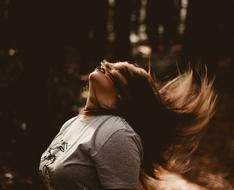 Woman with long winding hair outdoor