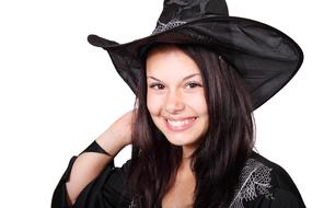 young woman in witch costume for Halloween