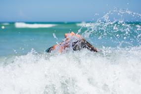 woman in sea having fun