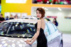Fashion Model, young asian Woman posing at car