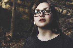 serious young girl with pierced nose