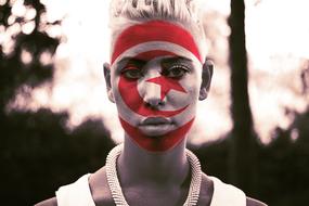 Tunisia flag makeup on girl's face