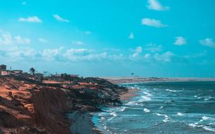 Beach beneath red cliff, Brazil, bahia