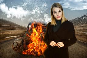 woman on the background of burning car