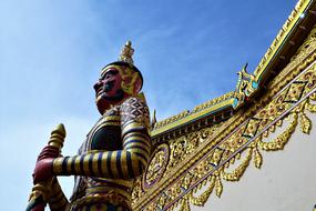 colorful sculpture, guardian of the Buddha at Temple