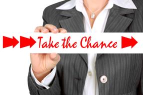 take the chance, shield in female hand