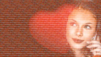 portrait of a girl on a brick wall