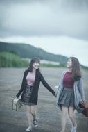 happy girlfriends on the beach