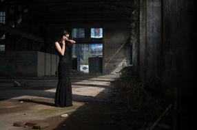posing woman in black dress