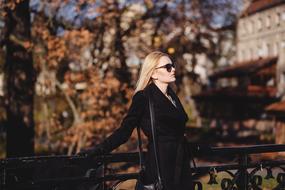 Woman in the black clothes on the landscape