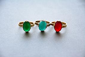 three Stylish golden Rings with gems