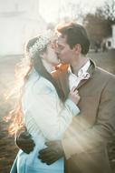 Couple in love, kissing in sunlight